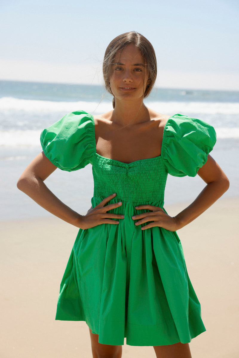Cut from a breathable cotton poplin, the Brac is a timeless and elevated mini dress you'll gravitate towards for summers to come. Designed with flirty puff sleeves, a shirred sweetheart bodice, and a full skirt. Its smocked detailing and pockets make this dress extremely comfortable as you travel from beach to bar!