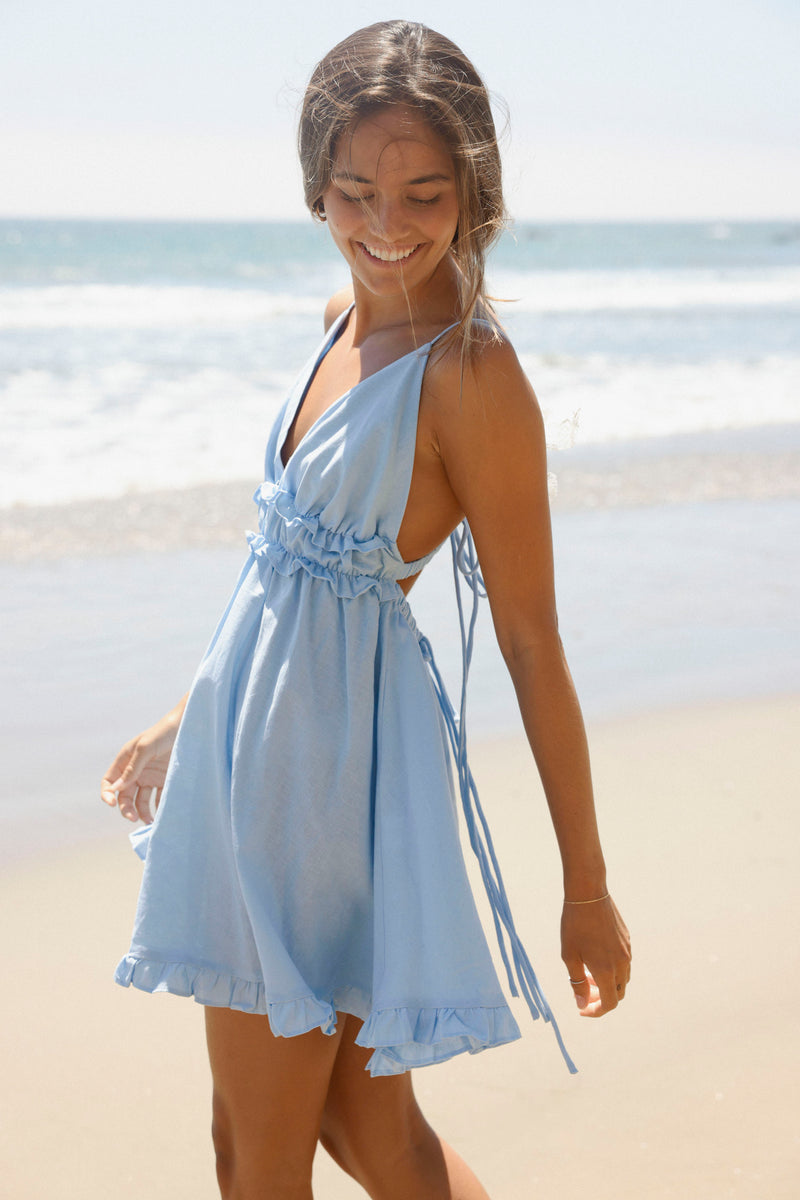 Meet your new go-to everyday dress! Our Corfu Dress features thin straps, a low back, and sweet ruffle detailing. It is completely adjustable. Its full skirt and gorgeous light blue color make it the sweetest dress!